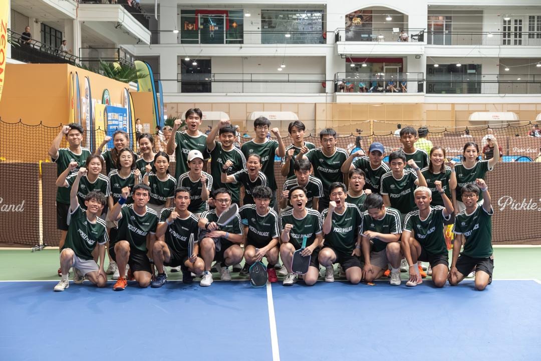 Pickle Palace team group photo on an indoor pickleball court